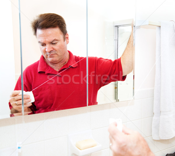 Morning Grooming - Dental Floss Stock photo © lisafx