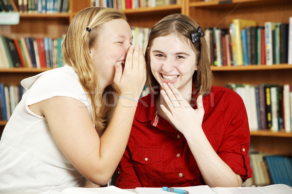 Chuchotement classe adolescentes secrets école bibliothèque [[stock_photo]] © lisafx