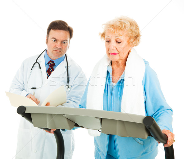 Medical senior doamnă banda de alergare Imagine de stoc © lisafx
