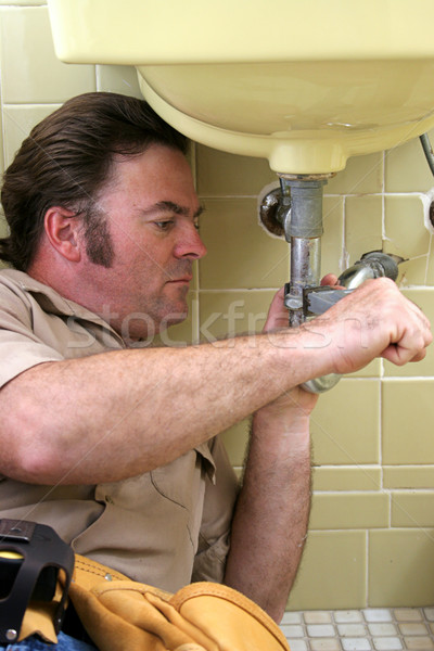 Plumber Using Pipe Wrench Stock photo © lisafx