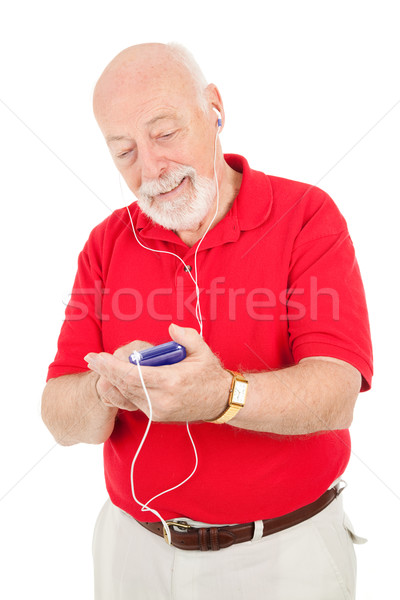 Senior man mp3-speler muziek collectie geïsoleerd Stockfoto © lisafx