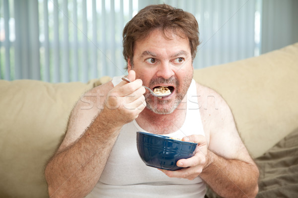 Sofá batata alimentação cereal desempregado homem Foto stock © lisafx