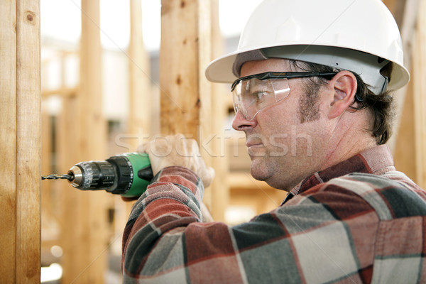 Sicherheit Job Bauarbeiter Bohren tragen Sicherheitsausrüstung Stock foto © lisafx