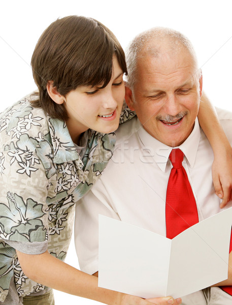 Son Reads Greeting Card to Dad Stock photo © lisafx