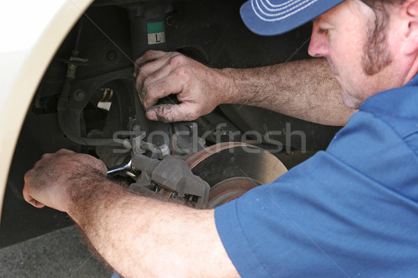 Auto Mechanic Works on Brakes Stock photo © lisafx