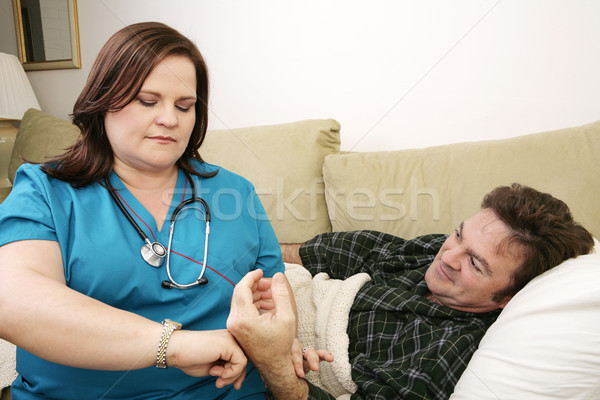 Otthon egészség pulzus nővér elvesz férfi Stock fotó © lisafx