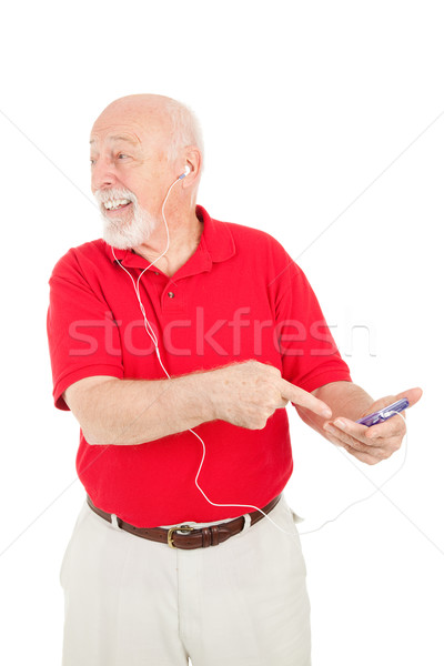 Starszy człowiek podniecony mp3 player mówić nowego Zdjęcia stock © lisafx