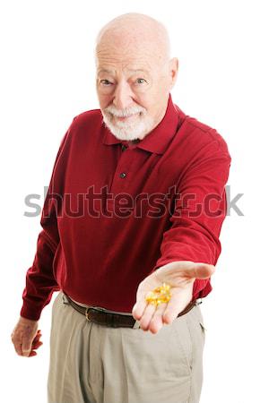 Idős férfi omega 3 halolaj tart ki Stock fotó © lisafx