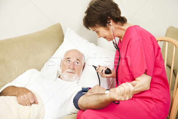 Home Health Nurse Takes Blood Pressure Stock photo © lisafx