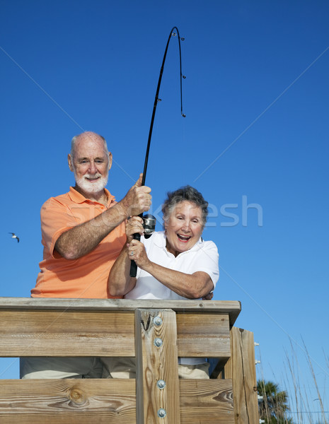 Senior Couple Reel in Fish Stock photo © lisafx