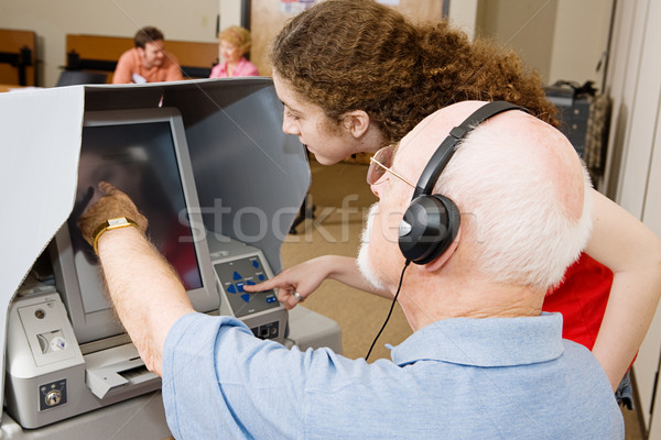 Wyborca pracownika nowego ekran dotykowy głosowanie Zdjęcia stock © lisafx