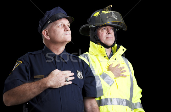 Ofiter de politie incendiu luptator mâini inimă Imagine de stoc © lisafx