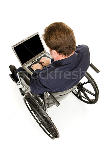 Disabled Businessman Typing Stock photo © lisafx