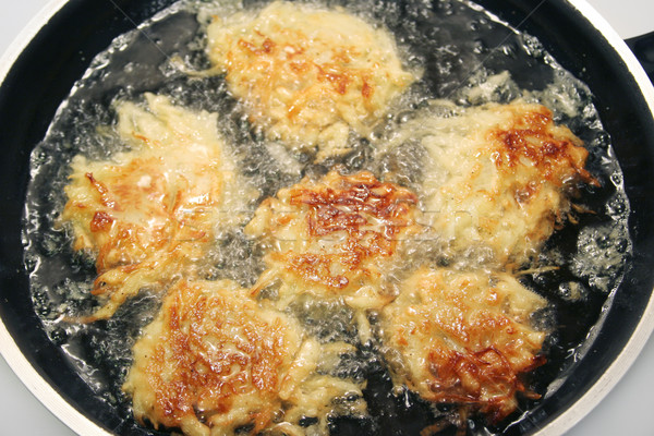 Potato Pancakes - Latkes Frying in Oil Stock photo © lisafx