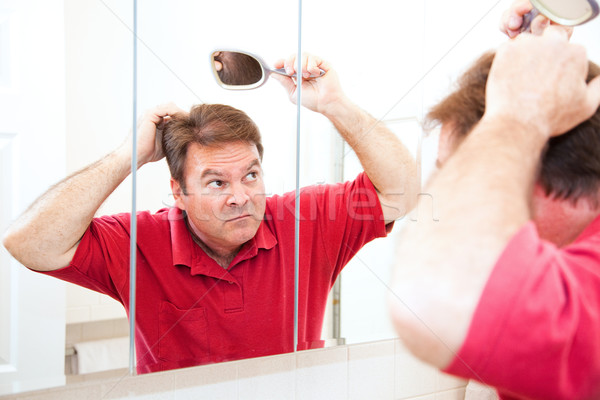 Középkorú férfi kopasz folt középkorú férfi néz Stock fotó © lisafx