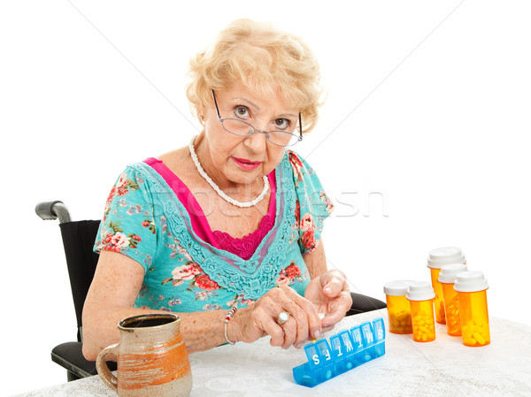 Senior Woman Sorting Pills Stock photo © lisafx