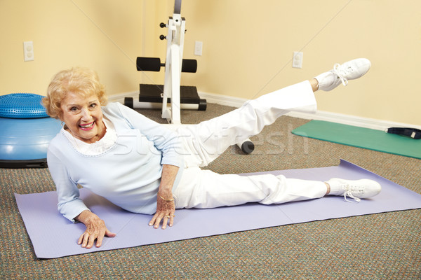 старший соответствовать счастливым женщину коврик для йоги Сток-фото © lisafx