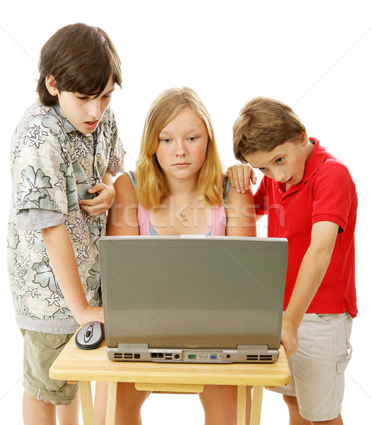 Serios trei copii calculator confuz Imagine de stoc © lisafx