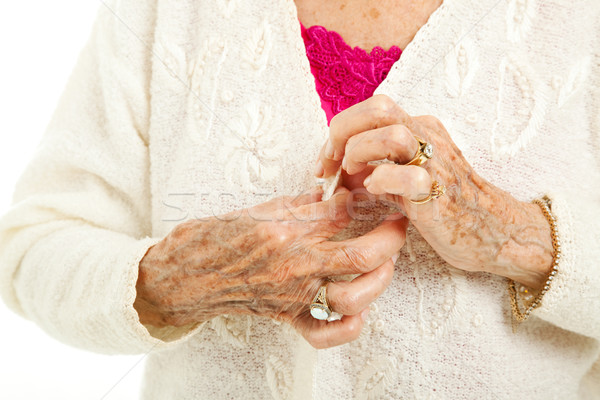 Nehézségek idős kezek küszködik gomb pulóver Stock fotó © lisafx