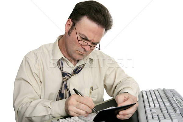 Equilibrio talonario de cheques concentración hombre aislado blanco Foto stock © lisafx