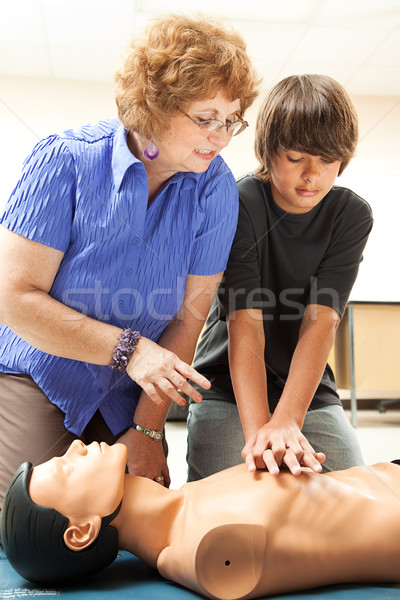 Tanít mesterséges lélegeztetés tanár segít tizenéves fiú tanul Stock fotó © lisafx