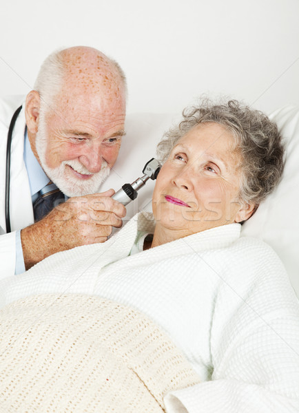 Doctor Examines Hospital Patient Stock photo © lisafx