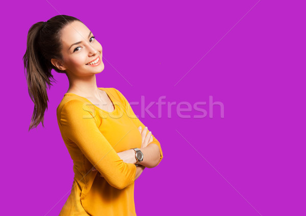 Expressief brunette portret geïsoleerd kleurrijk oranje Stockfoto © lithian