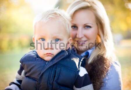 Cute kid and pretty mom outdoors at fall. Stock photo © lithian