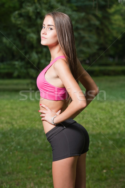 Beautiful slender young fitness girl. Stock photo © lithian