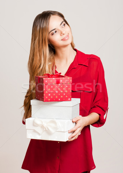 Beautiful young woman with gift boxes. Stock photo © lithian