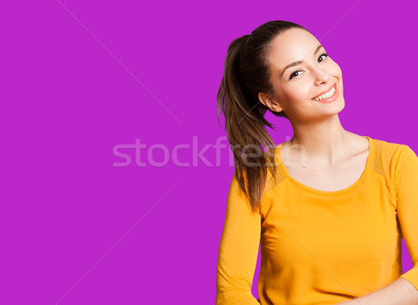 Expressief brunette portret geïsoleerd kleurrijk oranje Stockfoto © lithian