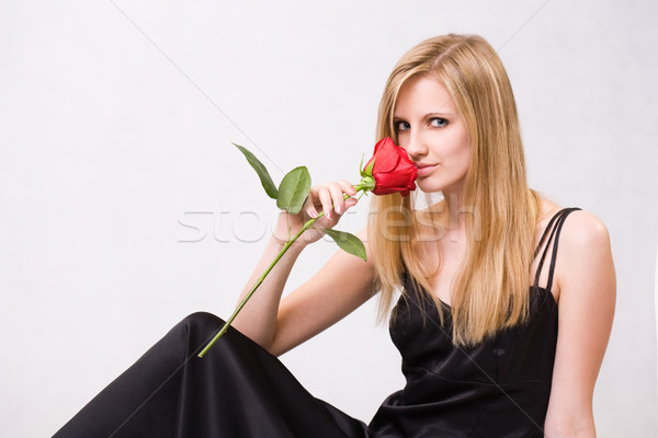 Gorgeous young blond woman holding rose. Stock photo © lithian