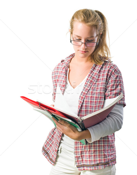 Pretty young student girl reading exercise books Stock photo © lithian