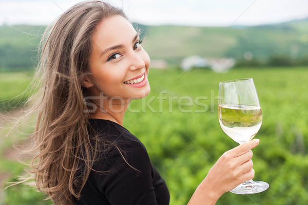 Stock photo: Brunette beauty having wine fun.
