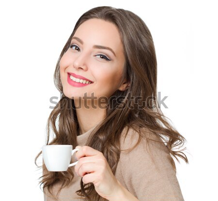 Beautiful young brunette enjoying coffee. Stock photo © lithian