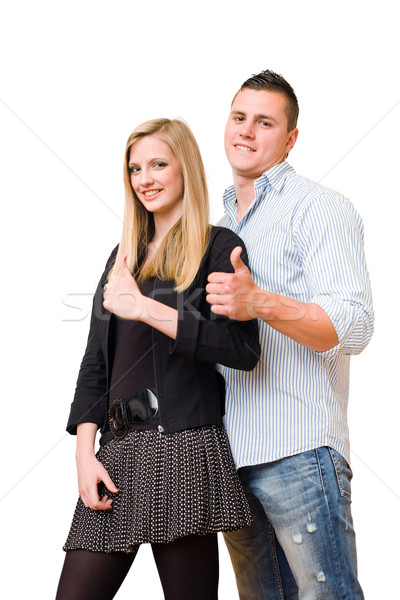 Young student couple showing big thumbs up. Stock photo © lithian