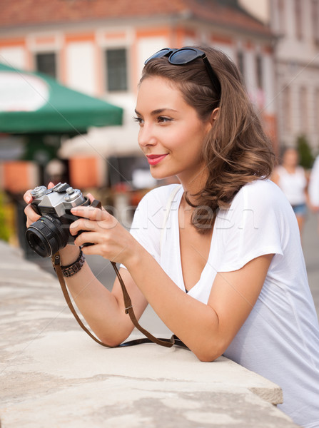 Brunette beauty taking photo. Stock photo © lithian