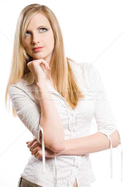 Beautiful young blond woman pondering. Stock photo © lithian