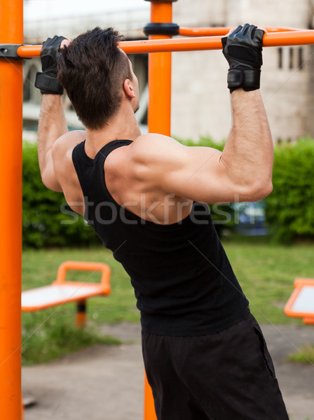 Outdoor workout on bars. Stock photo © lithian
