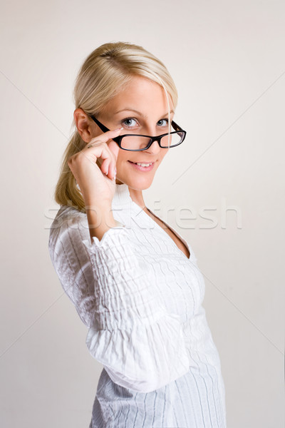 Friendly young business woman. Stock photo © lithian