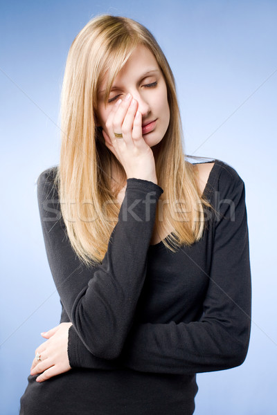 Sad looking young blond woman. Stock photo © lithian