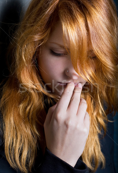 Moody dark portrait of a young redhead girl. Stock photo © lithian