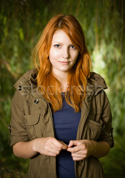 Beautiful young redhead girl outdoors. Stock photo © lithian