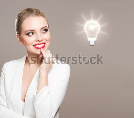 [[stock_photo]]: Blond · femme · ampoule · symbole · portrait