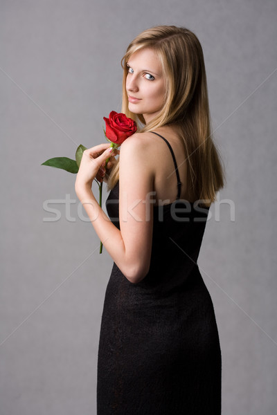 Gorgeous young blond woman holding rose. Stock photo © lithian