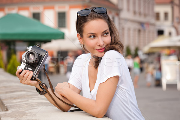 Brunette woman using analog camera. Stock photo © lithian