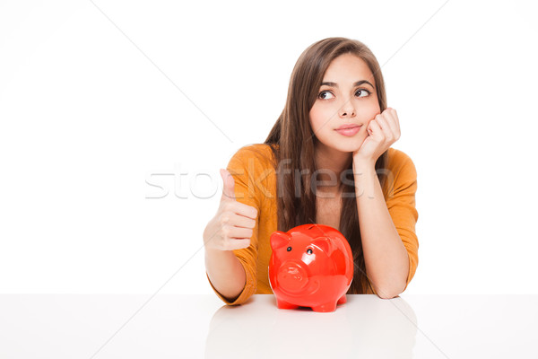 Brunetka banku piggy portret atrakcyjny młodych kobieta Zdjęcia stock © lithian