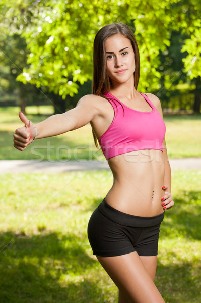 Beautiful slender young fitness girl. Stock photo © lithian