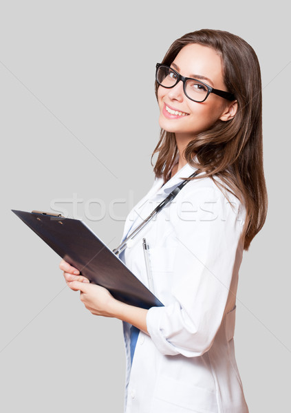 Young woman doctor with stethoscope. Stock photo © lithian