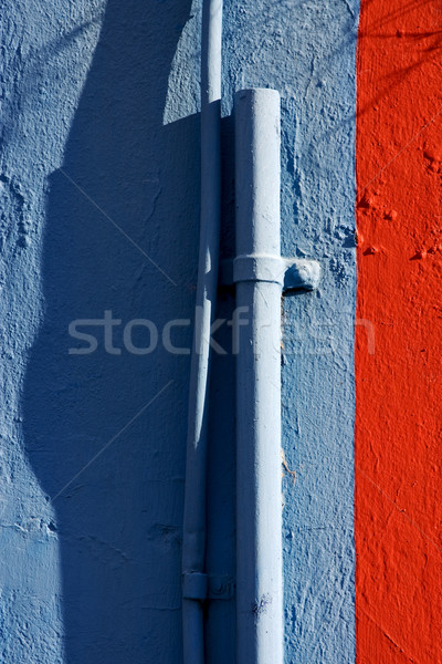 blue colored pipe and red wall  Stock photo © lkpro